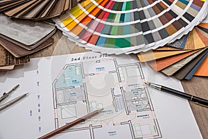 Architectural drawings with palette of colors and wooden sampler for furniture designs