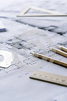 Architectural engineering design plan drawing on the table. Architect's work on table in studio. Construction design