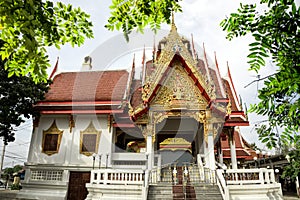 Architectural exterior view of the Buddhist temple in Damnoen Sa photo