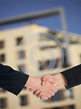 Architectural Handshaking in front of building