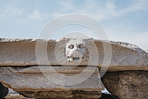 Architectural head details on the ruins on Sacred Way in island of Delos, Greece