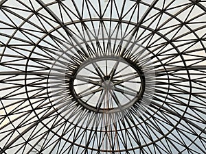 architectural interior of a dome with a glass skylight and circular design