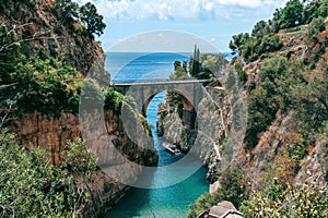 Architectural landmark, stone bridge. A view of the Fiordo of Furore in Amalfi coast, Travel and vacation concept. Summer day.