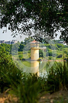 Architectural landscape of hydrological tower by the river