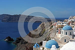 Architectural multiplicity Oia village on the edge of volcano caldera of Santorini island.