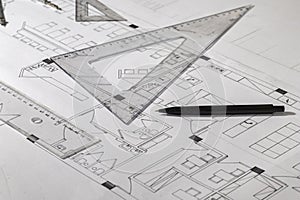 Architectural plans, pencil and ruler.