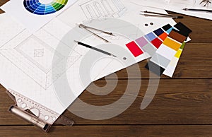 Architectural project, engineering tools on table.