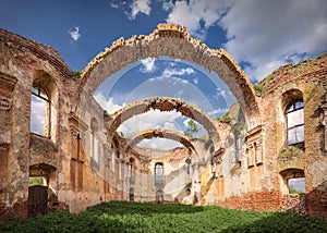 Architectural remains with prominent arches at sunny day