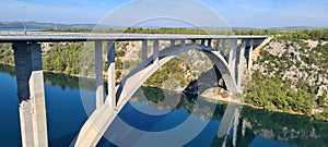 Architectural Serenity: A Bridge& x27;s Grace over Croatia& x27;s Krka River