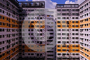 Architectural shot of public housing HDB flats in Singapore on sunny day. Dynamic angle; abstract; graphic; background