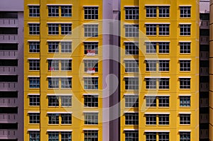 Architectural shot of public housing HDB flats in Singapore on sunny day. Dynamic angle; abstract; graphic; background