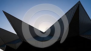 Architectural structure featuring angular, geometric roof elements