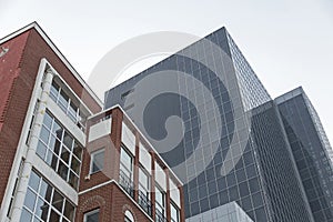  Architectural view of a old style building and a office one on background 