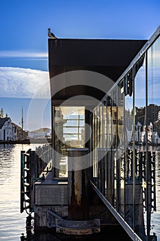 Architecture in Aalesund, Norway showing contrast between old and new buildings against the blue sky