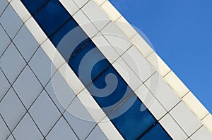 Architecture abstract blue glass wall on sky background