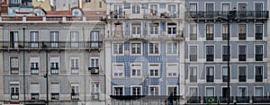 Architecture with azulejo tiles in the Old Town of Lisbon, Portugal. Buildings at the street