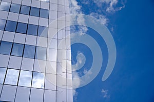 Architecture background fragment of a modern office building against blue sky