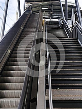 Architecture construction of elevator, escalator stairs and sky walk way, walk bridge between sky train station and department sto