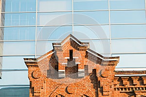 Architecture contrast old house and a new modern building