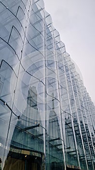 Architecture details wall curve Glass facade reflection Abstract background