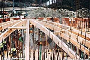 Architecture dome details at construction site. Industrial roof system of monastery building with wooden timber, beams and shingle