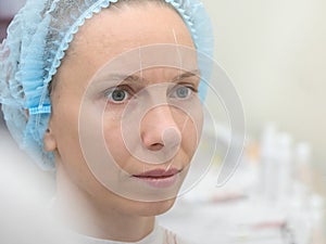 Coloring eyebrows with henna in the beauty salon.