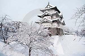 Architecture of Hirosaki Castle in winter season, covered with w