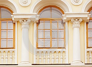 Architecture of the historic building with Windows arches and columns