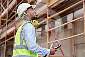 Architecture, inspection and checklist with black man on construction site for engineering, planning and building