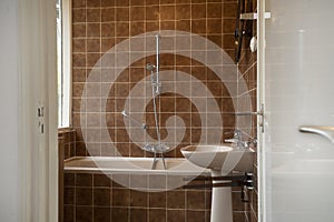 Architecture interior of a old vintage bathroom with brown tiles, Antique design, interior house concept