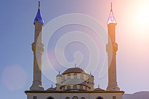 Architecture of the Islamic mosque in Turkey against the sunny blue sky. Byzantine style Muslim mosque.