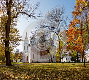 Architecture of Kievan Rus. Beautiful white old church with golden domes in autumnal park in Chernihiv, Ukraine