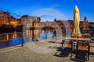 Architecture of the old town in Gdansk over Motlawa river at night