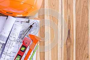 Architecture plan and rolls of blueprints with tool kit