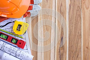 Architecture plan and rolls of blueprints with tool kit