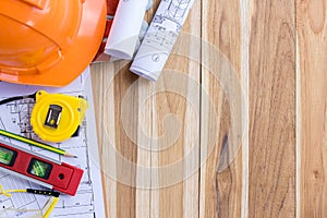 Architecture plan and rolls of blueprints with tool kit