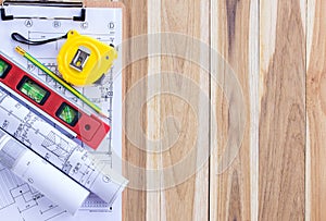 Architecture plan and rolls of blueprints with tool kit