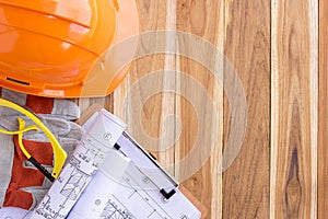 Architecture plan and rolls of blueprints with tool kit