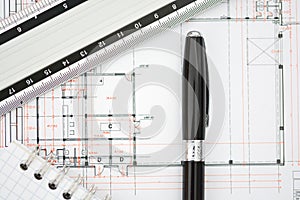Architecture plans of a building with blueprints, ruler and notebook