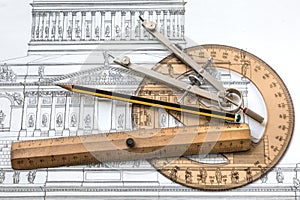 Project architecture with an old historic plan and useful tools. photo