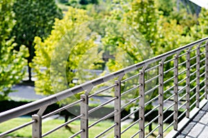 Architecture, railing on tree-lined park. photo