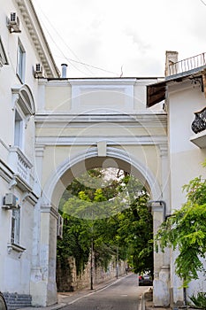 Architecture of Sevastopol. Old courtyard and arch on a summer day