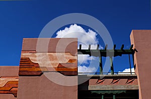 Architecture with southwestern design in stucco against blue sky with clouds, Santa Fe, New Mexico