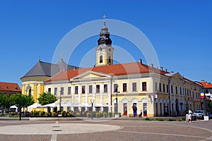 Architecture in the Unirii Square of Oradea. The Greek-Catholic Cathedral of St. Nicholas in the left of the photo.