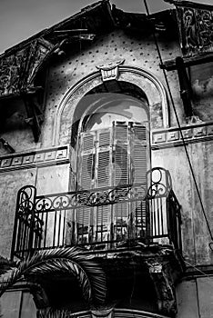 Architeture Details of Abandoned Hundred Years Old House, balconies in Black and White photo