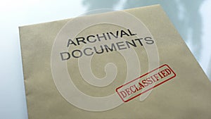 Archival documents declassified, seal stamped on folder with documents, close up photo