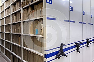 Archive, file, registration , mobile shelves with documents. Archive or office