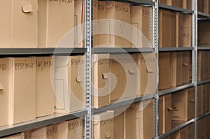 Cardboard Archive Boxes on Industrial Shelving in Document Storage Facility