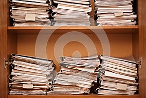 Archive. Wooden shelves with paper folders