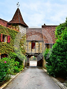 Archway over a street in the village of Autoire, France